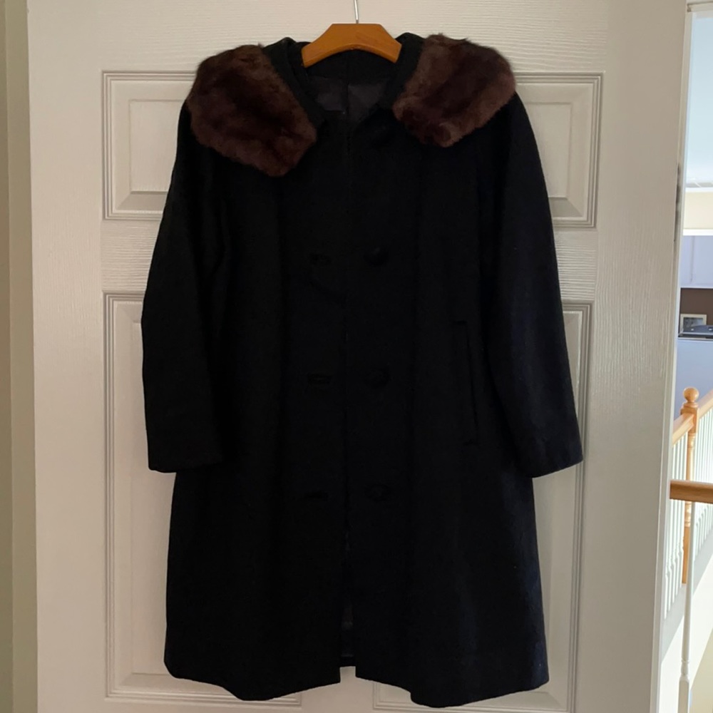Black jacket with brown fur collar